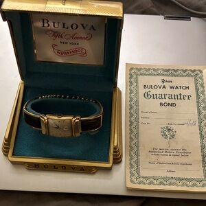 Men’s Bulova Gold and Black Timepiece with Original Guarantee Bond and Box